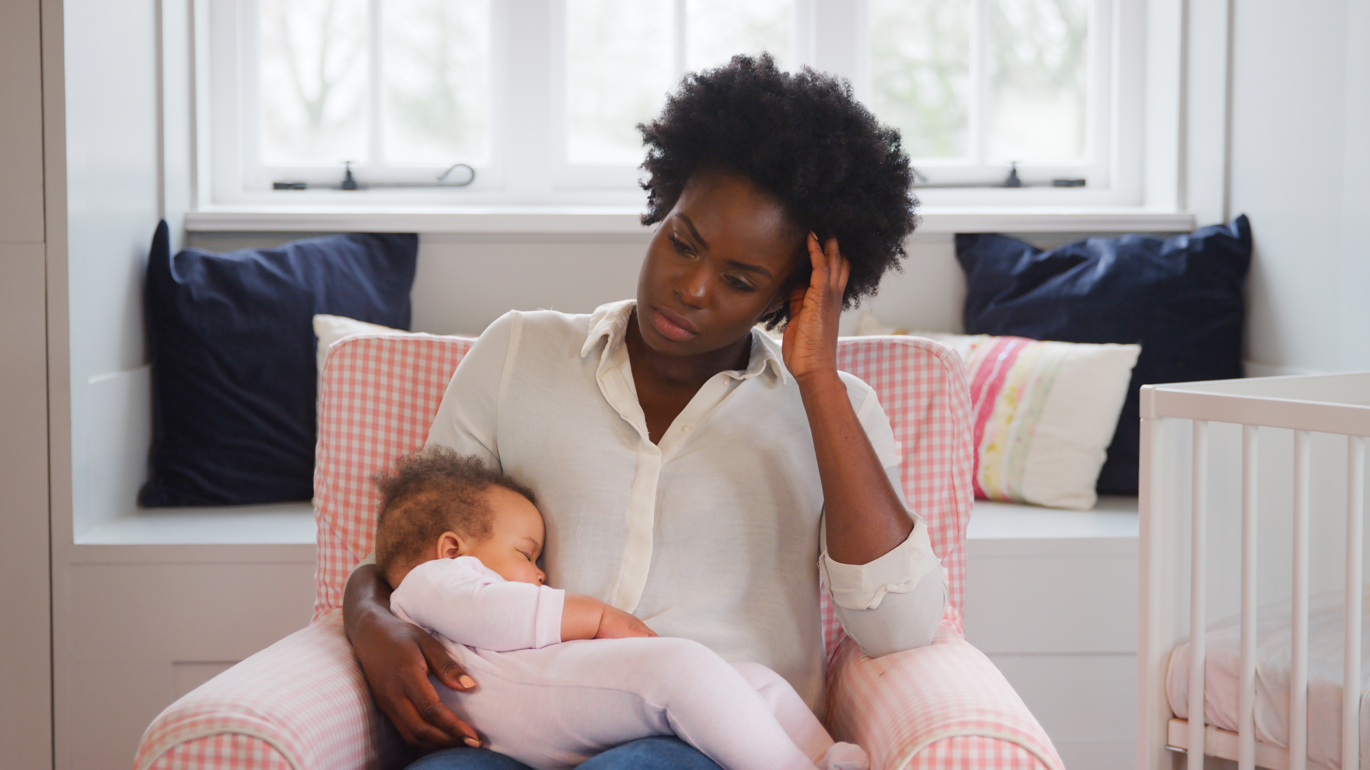 New,Mother,Suffering,With,Post,Natal,Depression,Holding,Sleeping,Baby