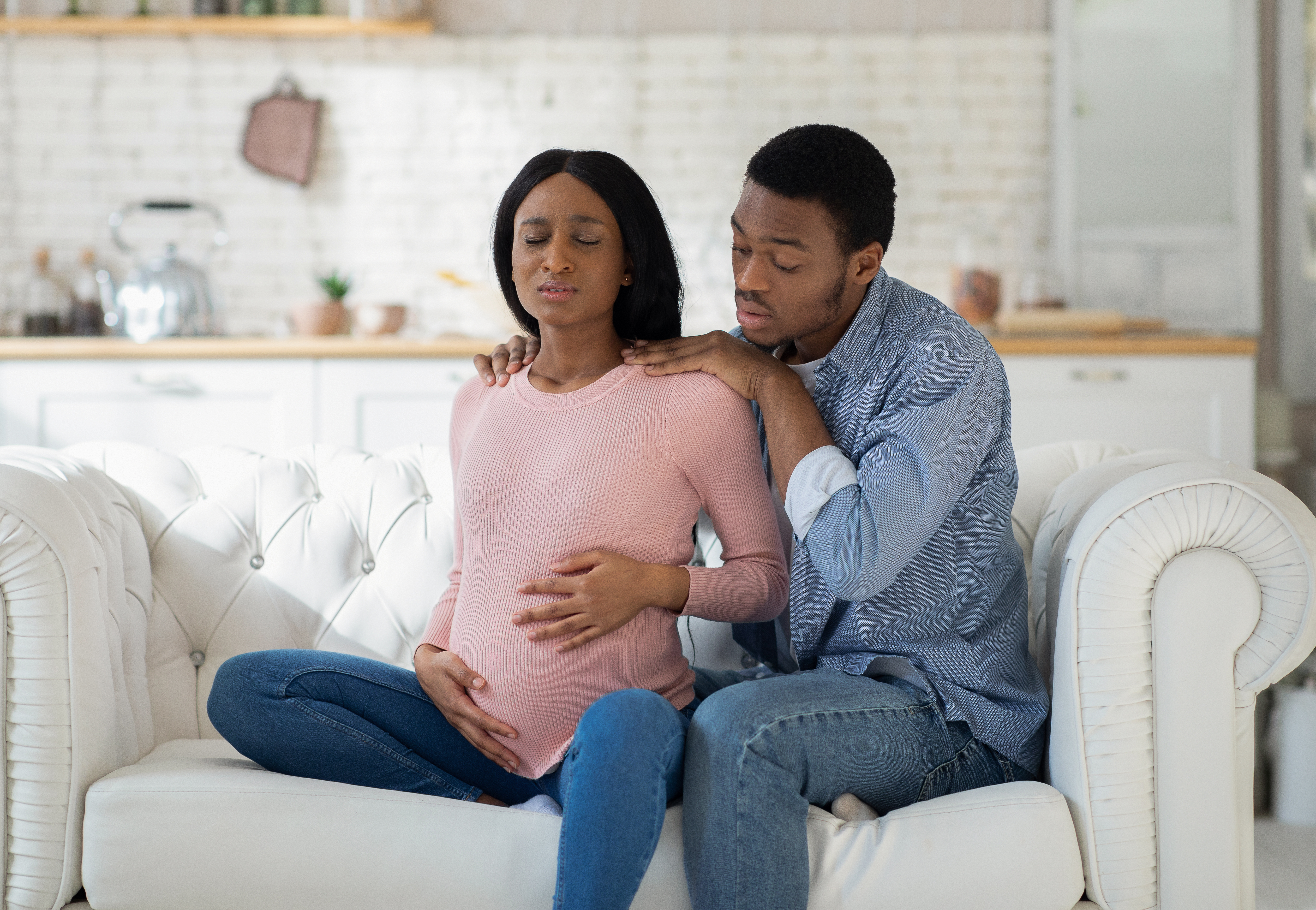 Worried,Black,Husband,Supporting,Pregnant,Wife,With,Prenatal,Contractions,At